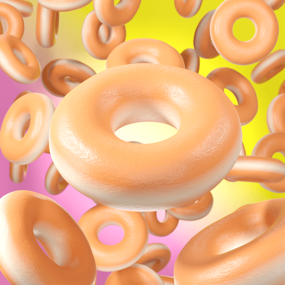 Close-up of floating doughnuts on colorful background