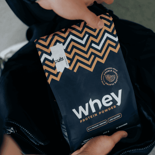 Puls Nutrition Whey Double Chocolate 550g in a backpack